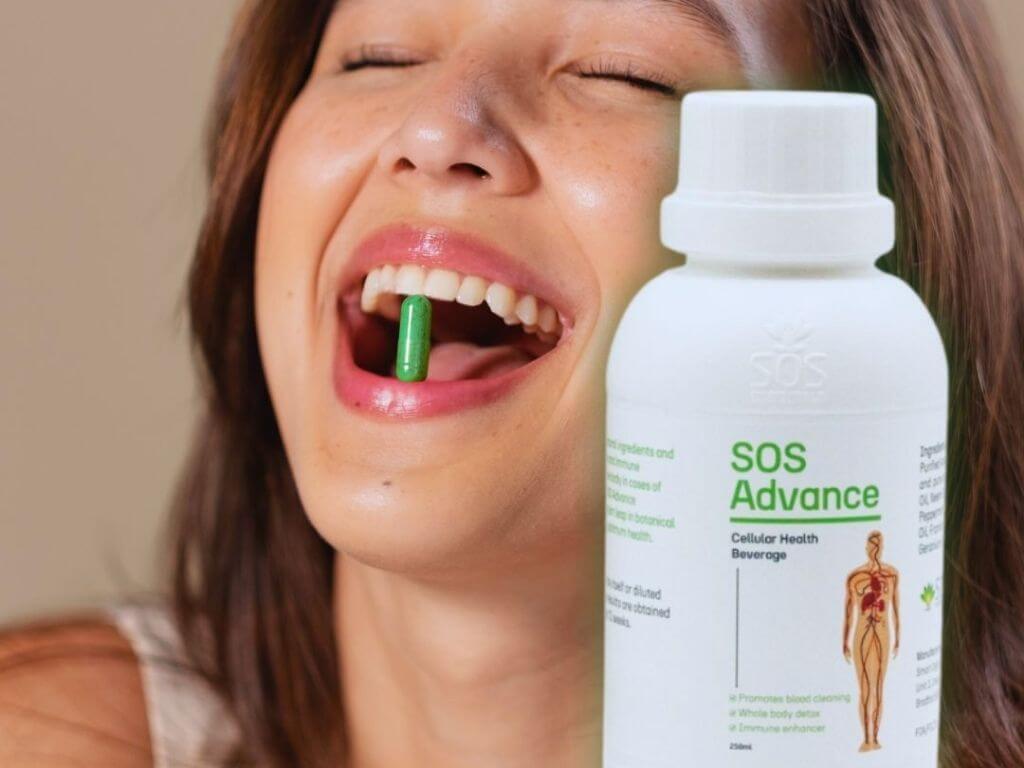 SOS Advance 250ml botanical food supplement bottle beside fresh herbs and essential oil droppers